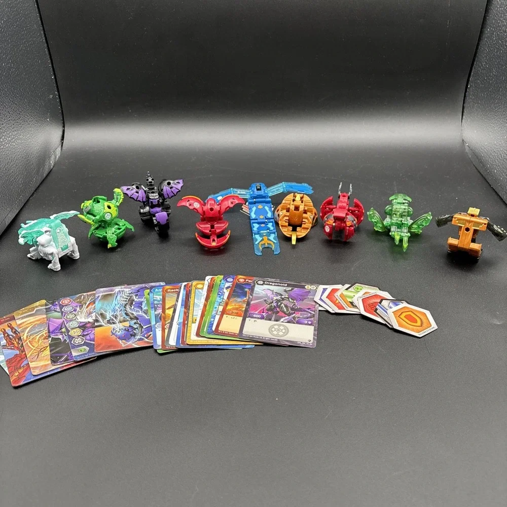 Lot Of 9 Bakugan Figures And 23 Bakugan Cards/Metal Card